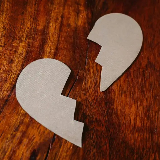 Broken Heart Cardboard on Brown Wooden Table Top